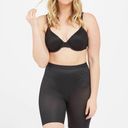 Spanx  Thinstincts 2.0 High-Waisted Mid-Thigh Short in Black Medium Photo 3