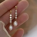 Elegant white pearl dangle drop earrings for women Gold Photo 1