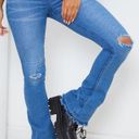 Pretty Little Thing Mid Blue Distressed Knee Flare Jean Photo 3