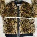 Uniqlo  By Carine Roitfeld faux fur bomber jacket, size large. Photo 5