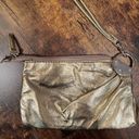 Chateau  | ladies metallic gold wristlet. Photo 1