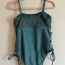 One Piece Green Swim Suit With Side Cut Outs Photo 2