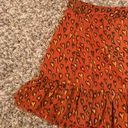 Urban Outfitters heart print, bow tie side, ruffle mini skirt Photo 1