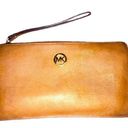 Michael Kors 🛍 Caramel Brown Pebble Leather Single Zip Clutch with Wrist Strap Photo 0