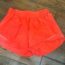 Lululemon Carnation Red  Hotty Hot shorts 4” Low rise Photo 0