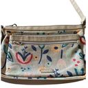 Relic super cute tan floral crossbody bag, top zip closure, two front zip pockets, inside zip pockets, inside card slots, adjust strap, excellent condition, measures 11x8 inches Photo 1