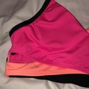 PINK - Victoria's Secret PINK Sport swim suit bikini top orange and pink in color size small spor…​ Photo 2