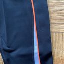 PE Nation black XS midrise workout leggings w/ orange piping and white detail Photo 3