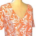 Nine Britton  cute new white tie front top with orange floral design. Photo 2