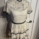 Shoshanna Stacia Lace Tiered Polka Dot Knee Length High Neck Black trim on neck/sleeve/bottom Hidden back zipper A flutter sleeve ballet lace fit-and-flare mini dress with ruffle detail below the waist ivory cream Kentucky Derby mock sheer layer Photo 3