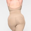 SKIMS  Seamless Sculpt Mid Thigh Short Shapewear in Mica Size Small Photo 1