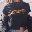 Brandy Melville  Los Angeles California 1984 Black Yellow Graphic Tee Photo 1