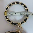 AWESOME GOLD AND BLACK ROUND PURSE WITH G&B WRISTELT HANDLE Photo 9