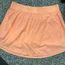 Alo Yoga Alo skort cantaloupe color size large Photo 0