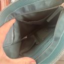 Tommy Bahama  teal leather and nylon organizing crossbody travel bag, pockets Photo 4