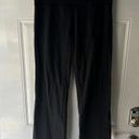 Lululemon  black bootcut leggings. No size but fits like a 10. Some wear Photo 3