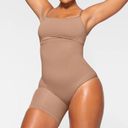 SKIMS  Seamless Sculpt Solution Short Left Leg Exposed Sienna Size Medium Photo 1