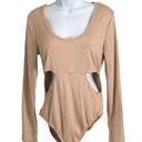 One Piece Love Streak Bodysuit Size L NWT  Elevate your wardrobe with this gorgeous Love Streak Bodysuit. Perfect for any occasion, this  features a flattering beige color and comfortable regular fit. The bodysuit is designed with a beautiful Love Streak brand that adds a touch of style and elegance. It's made with high-quality materials that guarantee durability and comfort.  This size L bodysuit is new with tags and is sure to make you feel confident and stylish. Whether you're dressing up for a night out or keeping it casual, this Love Streak Bodysuit is a must-have addition to your wardrobe. Photo 0