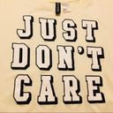 Urban Outfitters JUST DON’T CARE Cropped Graphic T- Shirt Photo 1