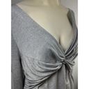 Donna Karen Empire twist top in silver. New without tag size XL.
OK Photo 1