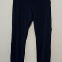 Vuori  Stride Legging in Navy Blue Side Pocket Back Zippered Pocket Photo 0