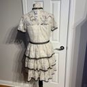 Shoshanna Stacia Lace Tiered Polka Dot Knee Length High Neck Black trim on neck/sleeve/bottom Hidden back zipper A flutter sleeve ballet lace fit-and-flare mini dress with ruffle detail below the waist ivory cream Kentucky Derby mock sheer layer Photo 4