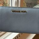 Michael Kors  light blue fold out wallet. Good condition Photo 1