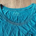 Patagonia  t-shirt, size XS. This woman’s tee is blue/green. Photo 3