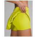 Lululemon  Women’s Pace Rival Mid Rise Pleated Serpentine Yellow Workout Skirt 10 Photo 3