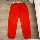 Nike swoosh red/orange sweatpants Photo 4