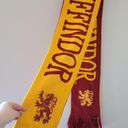 Harry Potter The Wizarding World of  Reversible Gryffindor Embroidered Sc… Photo 1