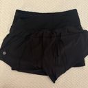 Lululemon size 2 high waisted limited edition flowey shorts with spandex under Photo 2