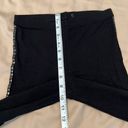 Size S black leggings w/ black detailing down the sides of the legs EUC Photo 2