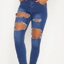 Pretty Little Thing  Khloe Extreme rip Women’s Skinny Jeans in Medium wash size 10 Photo 0