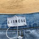 LIONESS  High Waisted Ripped Jeans in Blue Photo 1