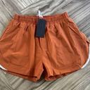 Alphalete Woman’s Infinity Stride Short W/ Liner - Sour Tangerine, Size Medium Photo 2