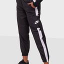 Nike Women's Sportswear Repel Essential Woven Jogger Pants Photo 0