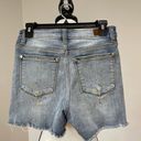 Judy Blue  paint slash distressed shorts in a size small Photo 13