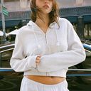 Brandy Melville  John Galt Light Gray Crystal
Cropped Hoodie Photo 0