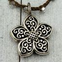 Brighton  Silver Toned Flower Reversible Pendant on a Brown Braided Cord. EUC! Photo 0