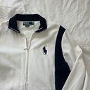 Polo by Ralph Lauren full zip jacket Size medium Condition: great Color: white and navy Details : - Full zip Photo 1