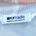 LA Made REVOLVE  Cold Shoulder Sweatshirt in Ivory and Tangerine size S EUC! Photo 2