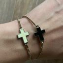 Urban Outfitters Ivory and black cross charm gold bracelets set Photo 1