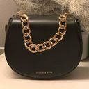 Charles and Keith Charles Keith Black Saddle Bag With Gold Chain Detail Photo 0