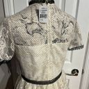 Shoshanna Stacia Lace Tiered Polka Dot Knee Length High Neck Black trim on neck/sleeve/bottom Hidden back zipper A flutter sleeve ballet lace fit-and-flare mini dress with ruffle detail below the waist ivory cream Kentucky Derby mock sheer layer Photo 5