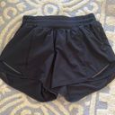 Lululemon black hotty hot shorts size 4, 4 inch Inseam Photo 0