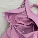 Free People Movement Here On Out Strappy Onesie Romper   Size XS  Condition: NWT  Color: bright orchid   Details : - See photo for approx. inseam measurement laying flat  - Built-in bra - not padded - Side pockets. Photo 5