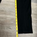 Bebe women logo leggings are a size Medium. Photo 7