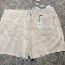 Forever 21 Mid-Rise Raw-Cut Denim Shorts
Size 34
Color is light beige
Brand is  Photo 1