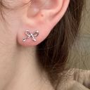 Trendy Silver Bow Earrings Studs Photo 0